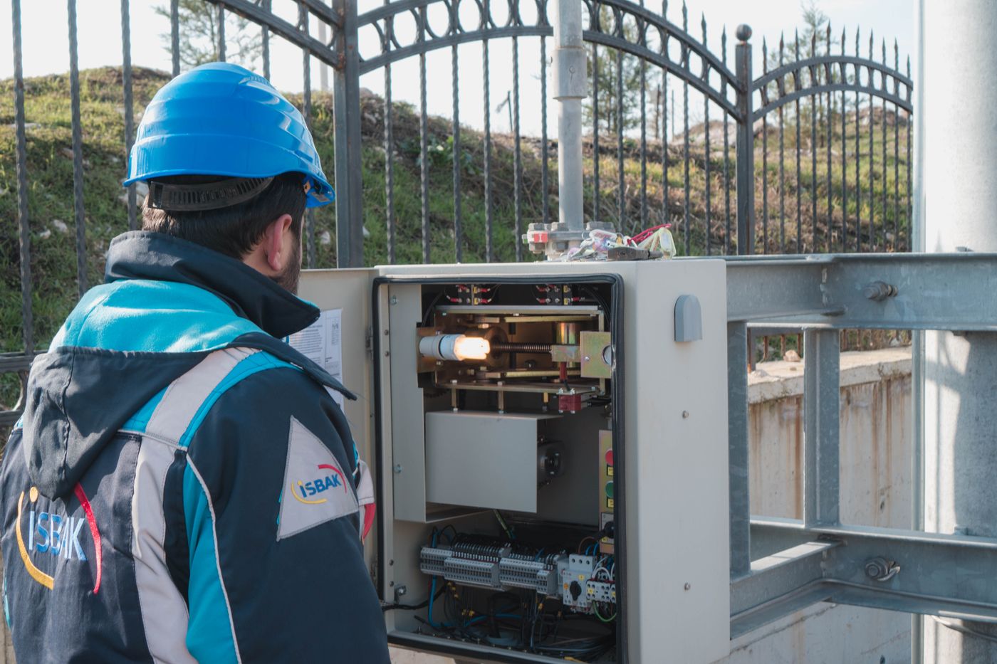 Electrician inspecting an electrical fuse box