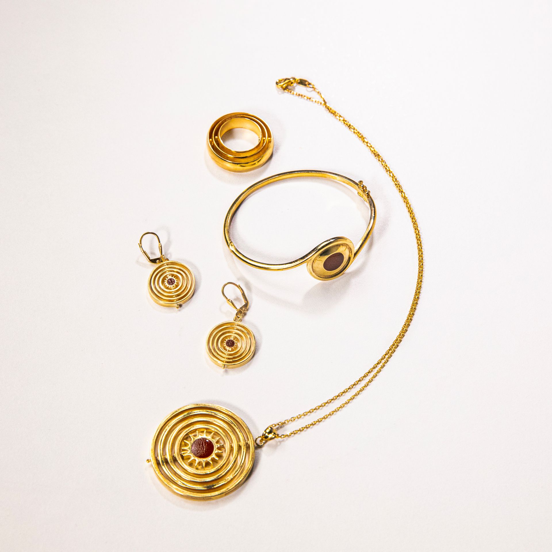 Gold necklace, earrings, rings and bracelet